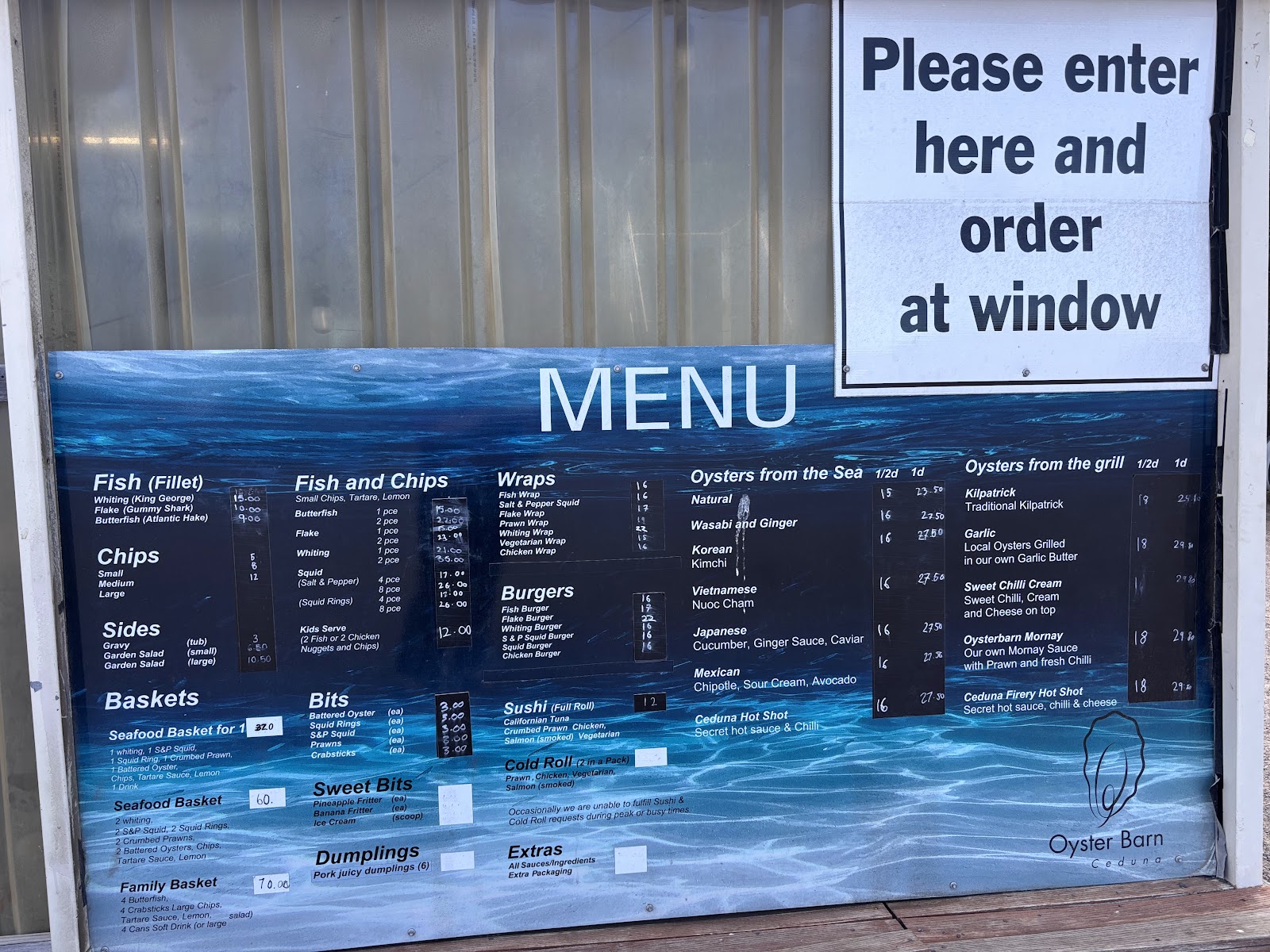 The Oyster Barn menu board at the order window